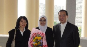 Nazifah Zainun with the mover Ms Aimee Liew and her Master Mr Alex Chang
